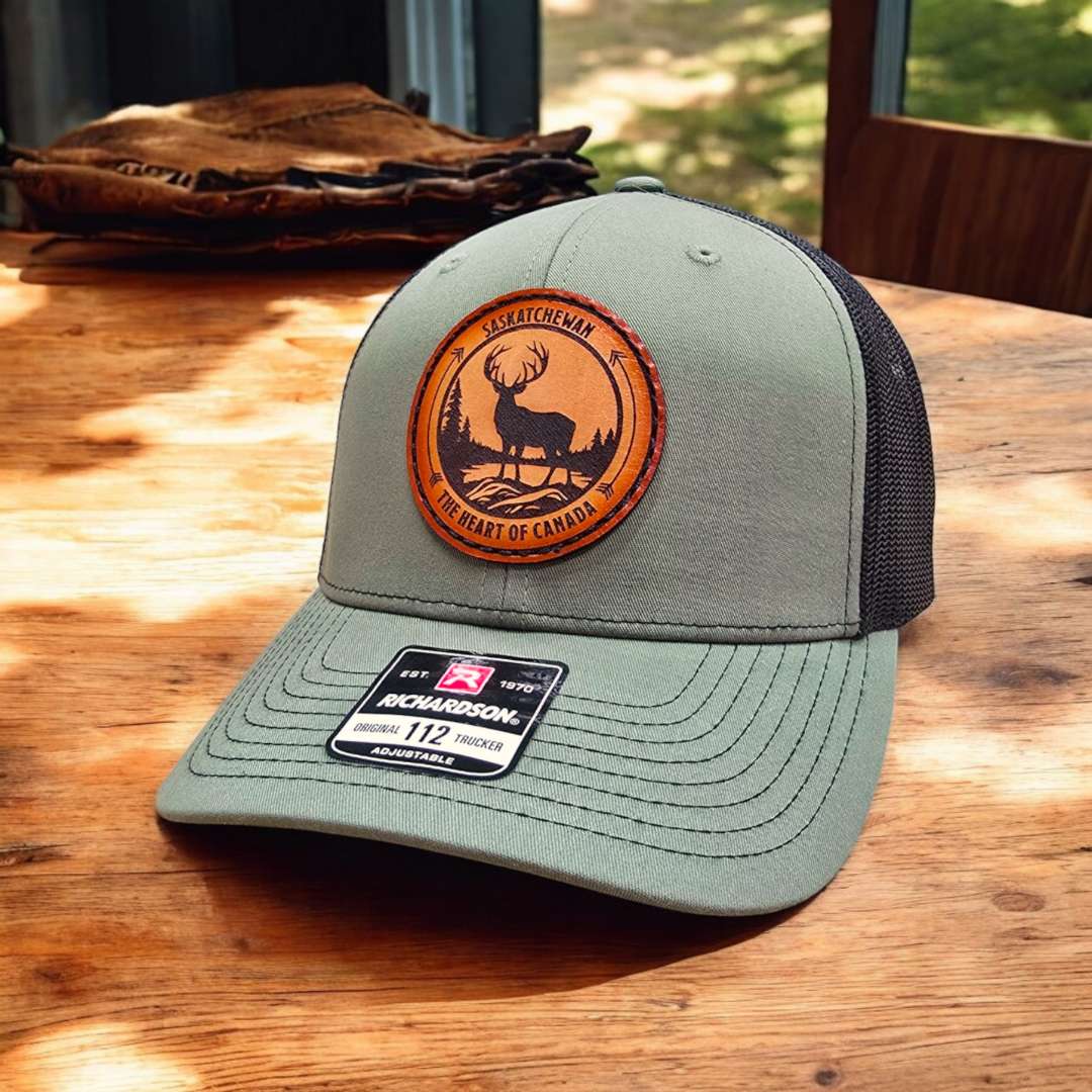 Embroidery on a grey hat in Saskatoon by lime tree