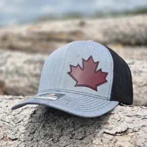Classic Canadian Maple Leaf Hat featuring a maroon leatherette maple leaf patch on a Richardson 112 snapback trucker hat.