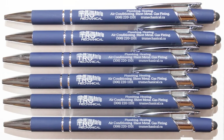 Six custom laser engraved blue promotional pens featuring the Tru Mechanical company logo, contact information, and chrome accents, created by Lime Tree YXE.